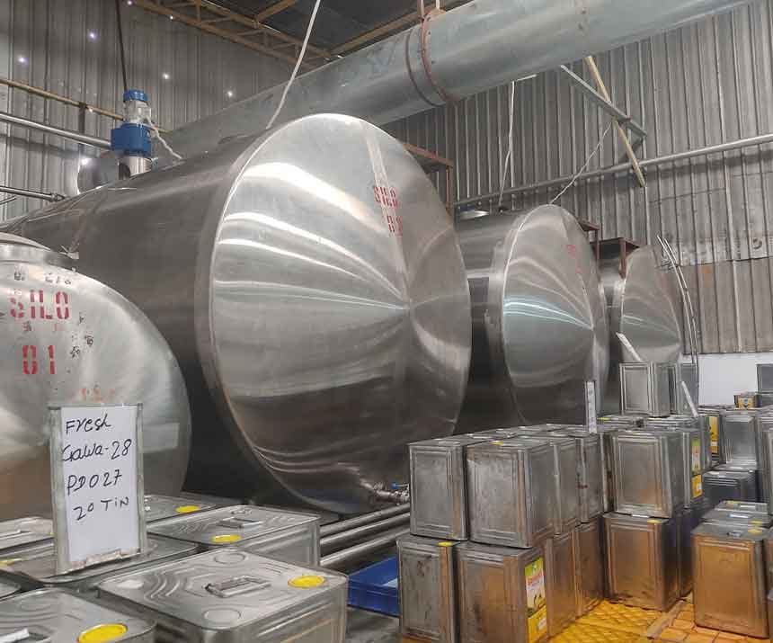 Prabha Dairy storage silos and ghee tins